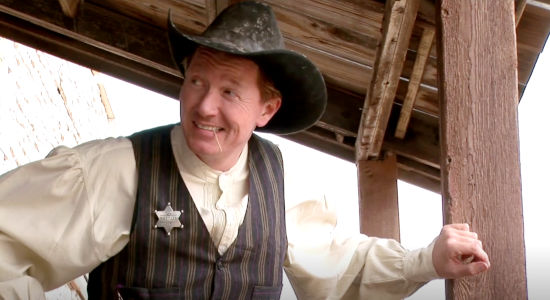 Walt Roberts as Sheriff Bill Mason, finding a drunk who's not really drunk in The Magnificent Dead (2010)