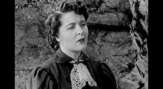 Audrey Dineen as Mr.s Hallison, a stage passenger with a closely guarded secret in Scorching Fury (1952)
