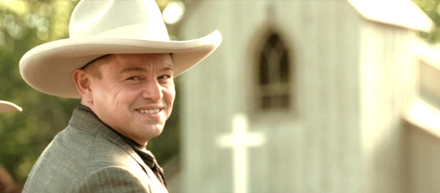 Leonardo DiCaprio as Ernest Burkhart, flashing the smile that wins over Mollie in Killers of the Flower Moon (2023)