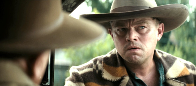 Leonardo DiCaprio, trying to sort out the latest directive from his uncle in Killers of the Flower Moon (2023)