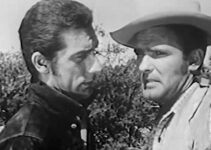 Richard Devon as Kirk Flamer tries to talk friend Clint Rust out of a showdown with a cold-blooded killer in Scorching Fury (1952)