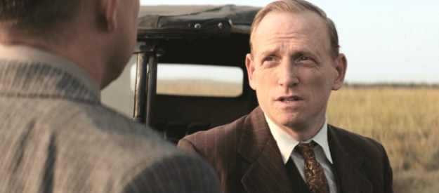 Scott Shepherd as Byron Burkhart, trying to cover his tracks after a series of mysterious deaths in Killers of the Flower Moon (2023)