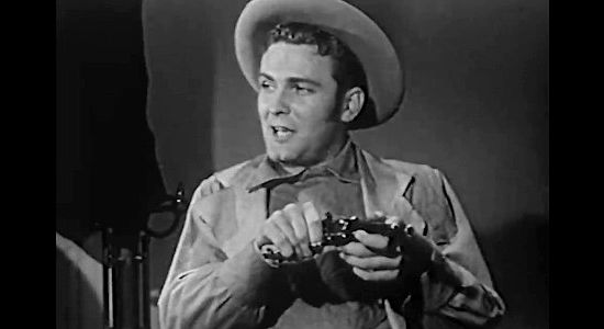 William Leslie as Clint Rust, a young deputy determined to avenge his uncle's death in Scorching Fury (1952)