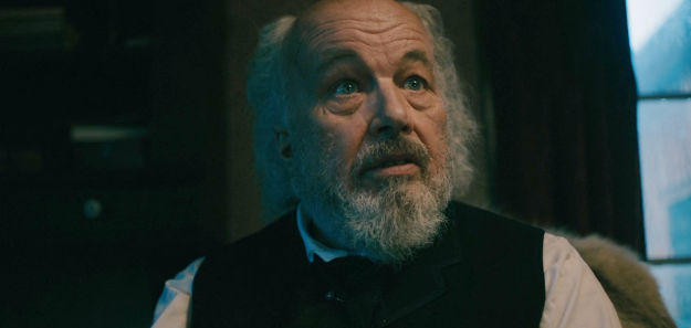 Clint Howard as George Derne, trying to steal property from other business owners in Hemlock Gulch in The Wolf and the Lamb (2026)