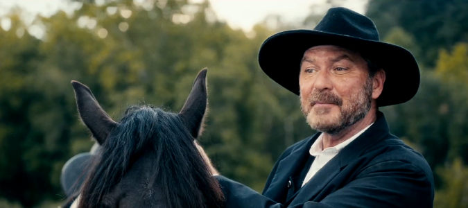 James Edward Holley as The Reverend, meeting the Collier family in Valley of the Shadow (2026)