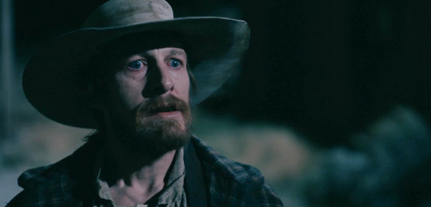 James Landry Hebert as Deputy Jim Cooley, willing to bend the law to help Sheriff Frank Martin in The Wolf and the Lamb (2026)