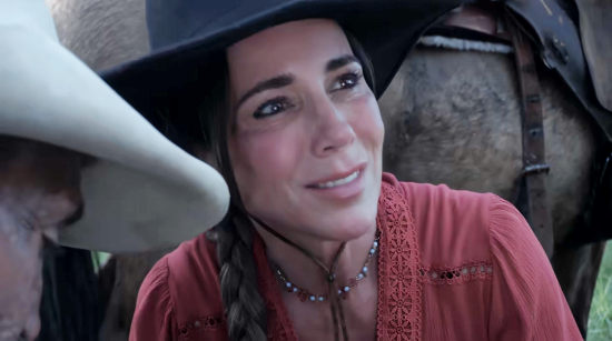 Michelle Malone as Angel, helping tend to a wounded friend in The Whore and the Horseman (2025)
