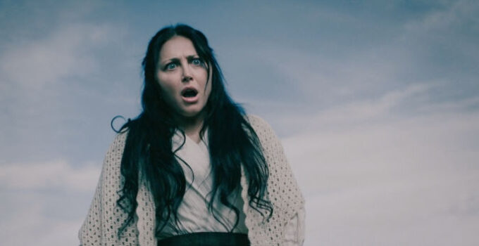 Cassandra Scerbo as Josephine 'Jo' Beckett watches her son go on the attack in The Wolf and the Lamb (2026)
