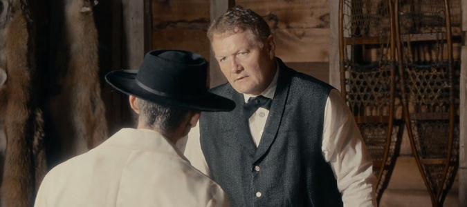 Robert Elswick as the trading post proprietor, dealing with a snake oil salesman in Valley of the Shadow (2026)
