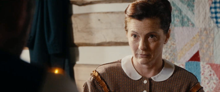 Shelly Looudin as the wife of The Reverend, about to face his wrath, in Valley of the Shadow (2026)