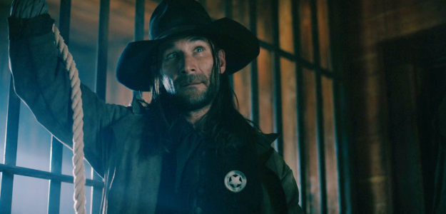 Zach McGowan as Sheriff Frank Martin, about to hang an Indian woman as a scapegoat for all that's gone wrong in The Wolf and the Lamb (2026)